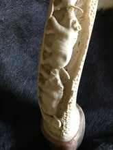 Load image into Gallery viewer, Family Group of Warthogs carved on Kudu Inner Horn.
