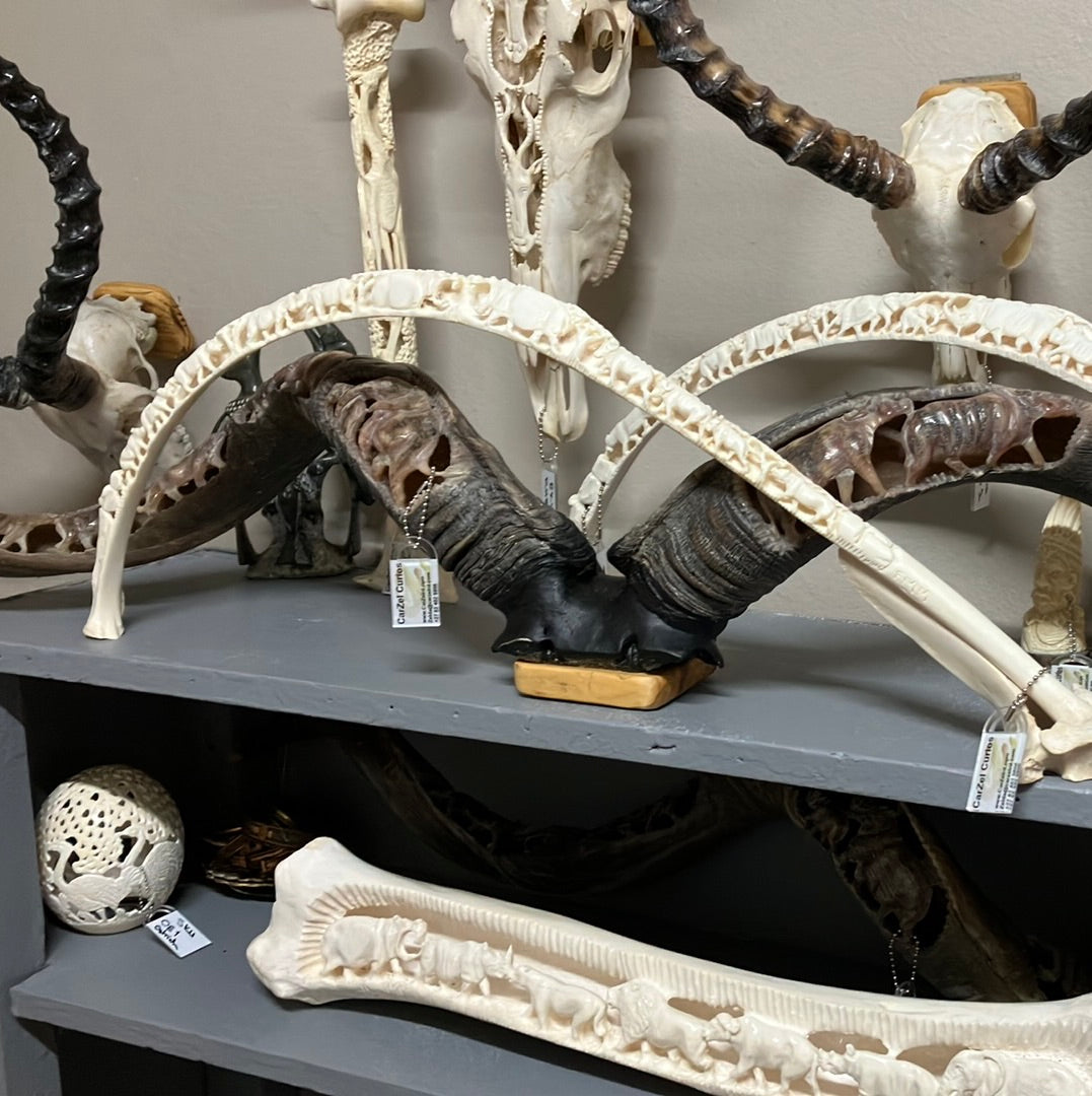 Giraffe Rib Bone Carving - Hippo centered, Buffalo and Zebra Giraffe Rib Bone Carving - Hippo centered, Buffalo and Zebra